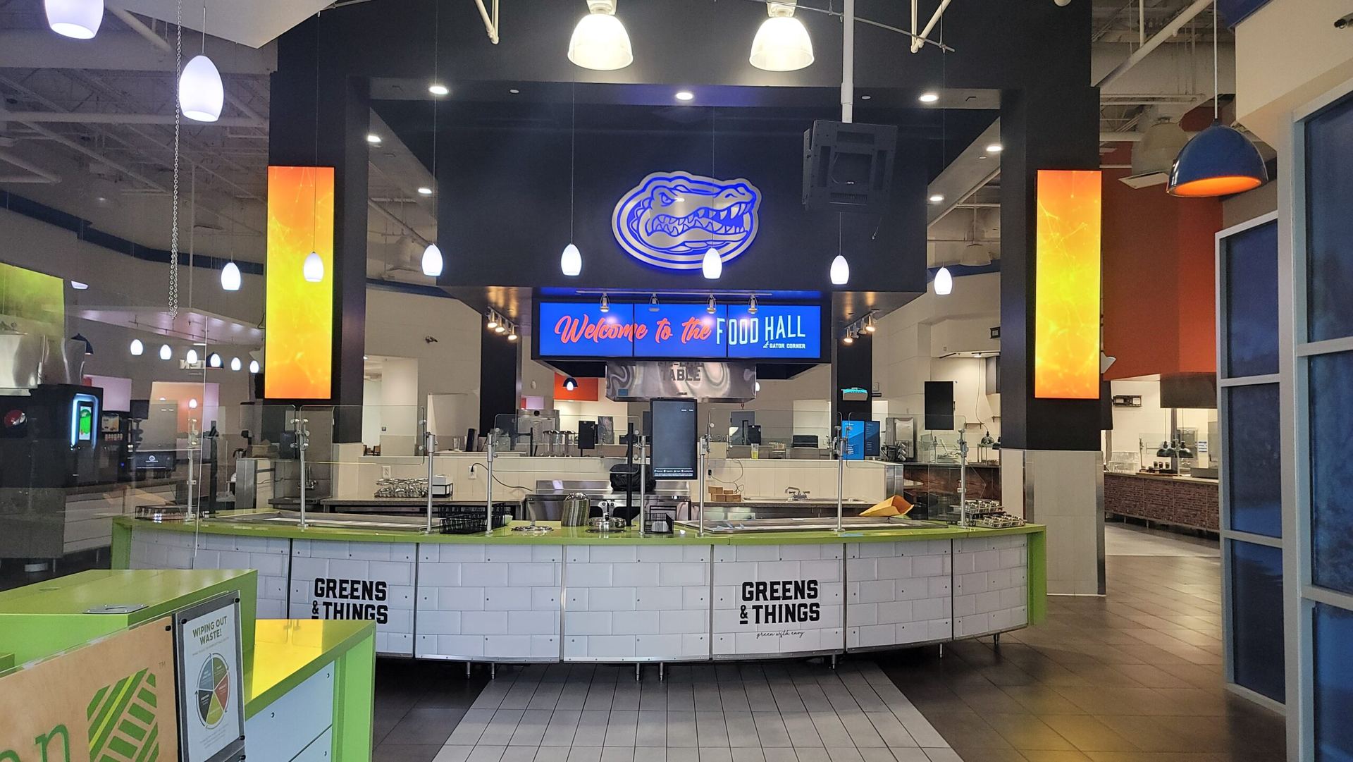 WAND digital menu boards above a restaurant service counter